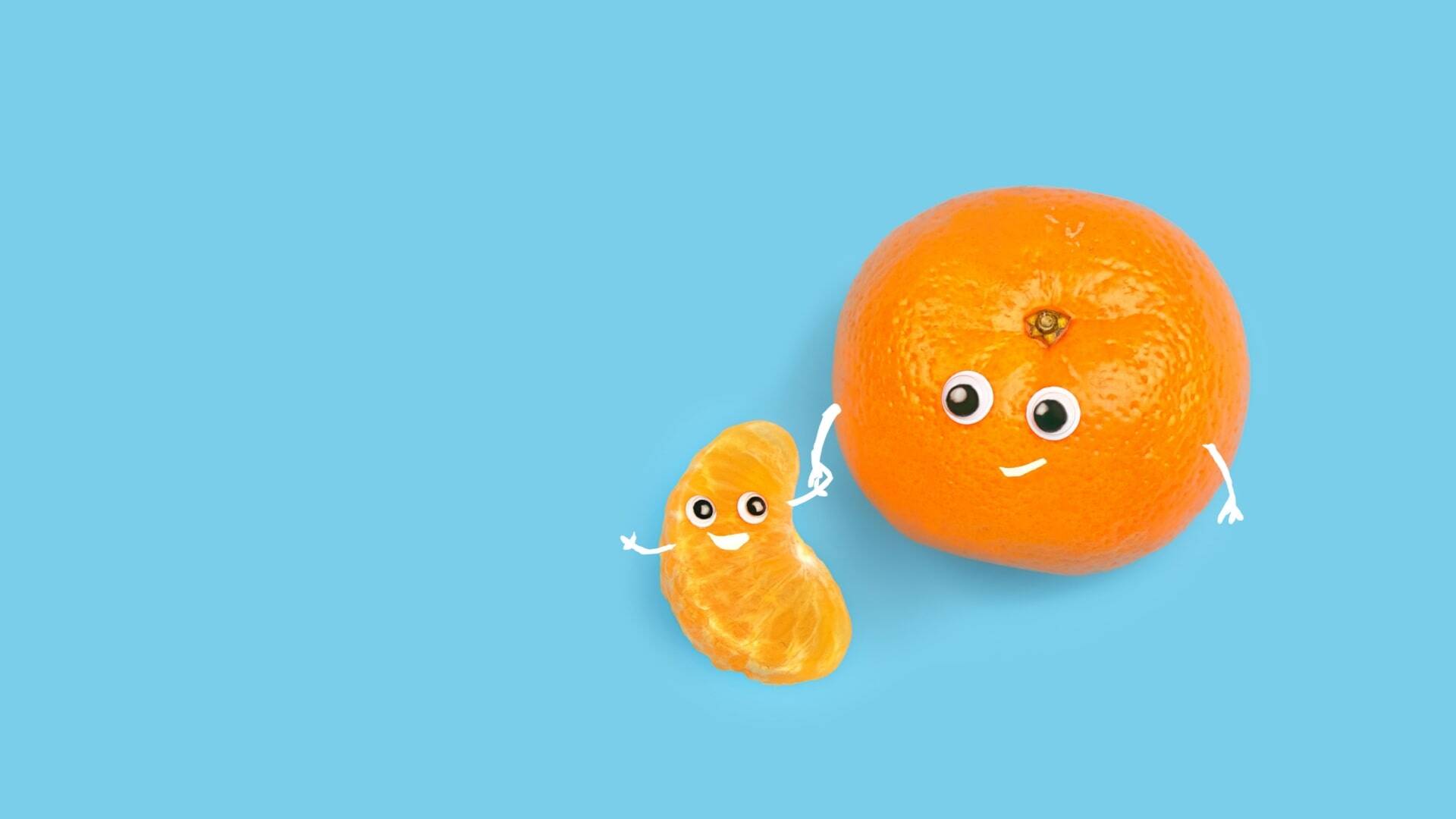 tangerine and slice on blue background